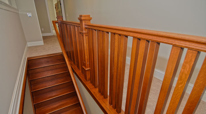 ICH Builders Mt. Sterling residence custom build second story view foocusing on the wooden railing and stairs